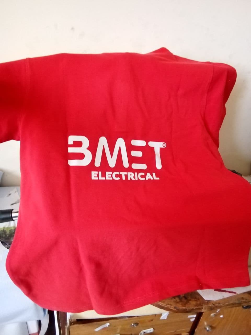 BMET Electrical — branded staff polos